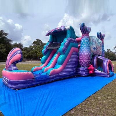 Château gonflable de sirène coloré avec toboggan et location de soirée de piscine