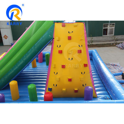 Des glissières sèches gonflables extérieures de couleur personnalisée avec double voie et mur d'escalade